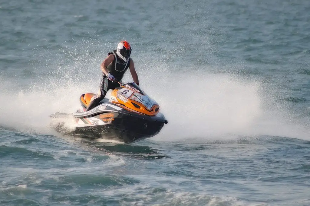 Helmeted Man Jet Skiing